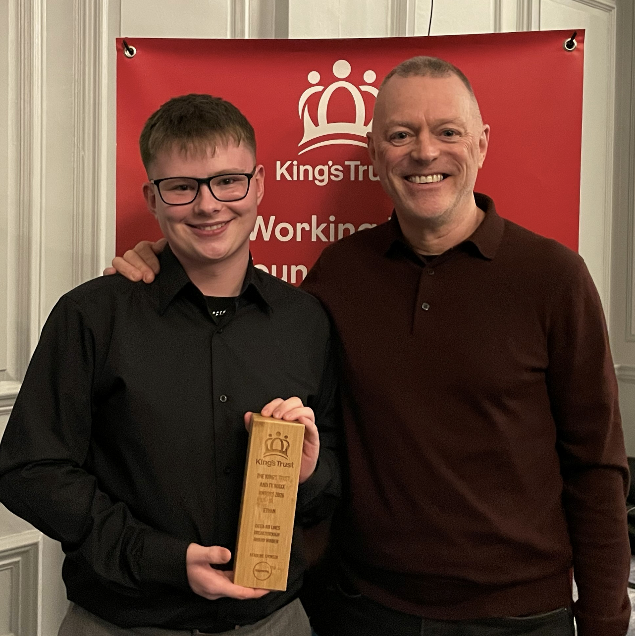 two people smiling at the camera