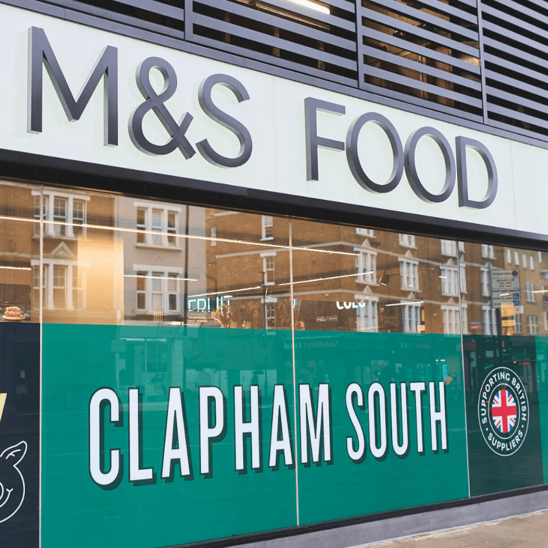 The exterior of an M&S Food store with Clapham South written on the windows