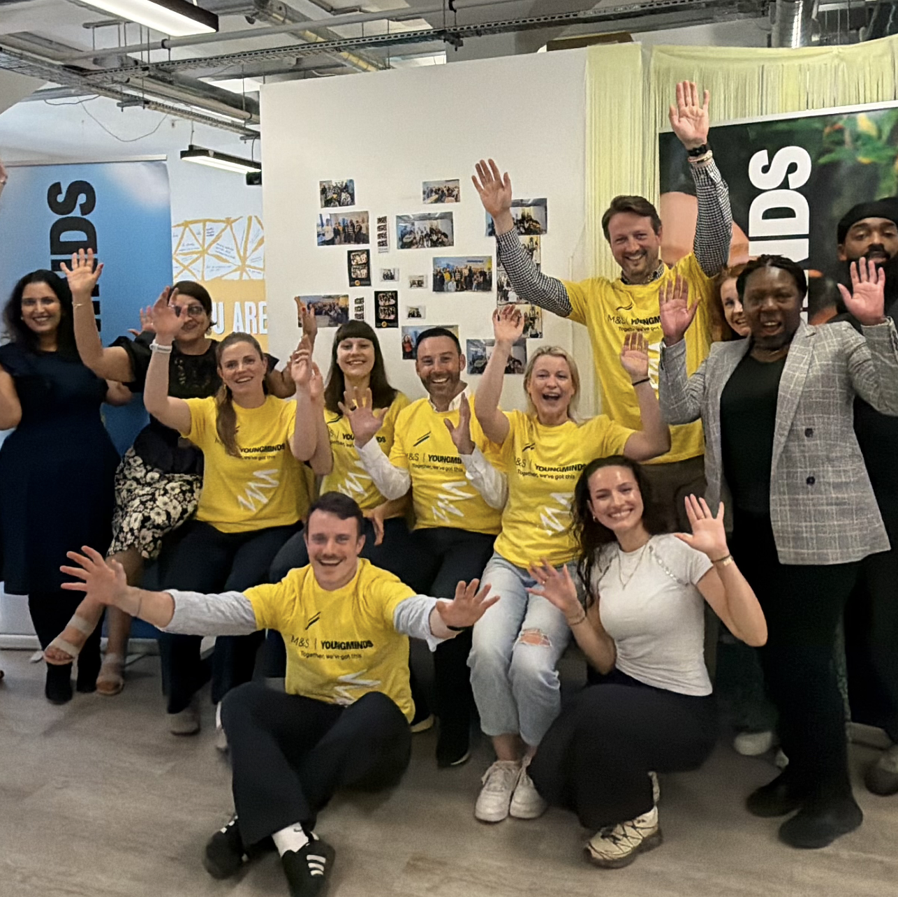 a group of people wearing yellow t-shirts