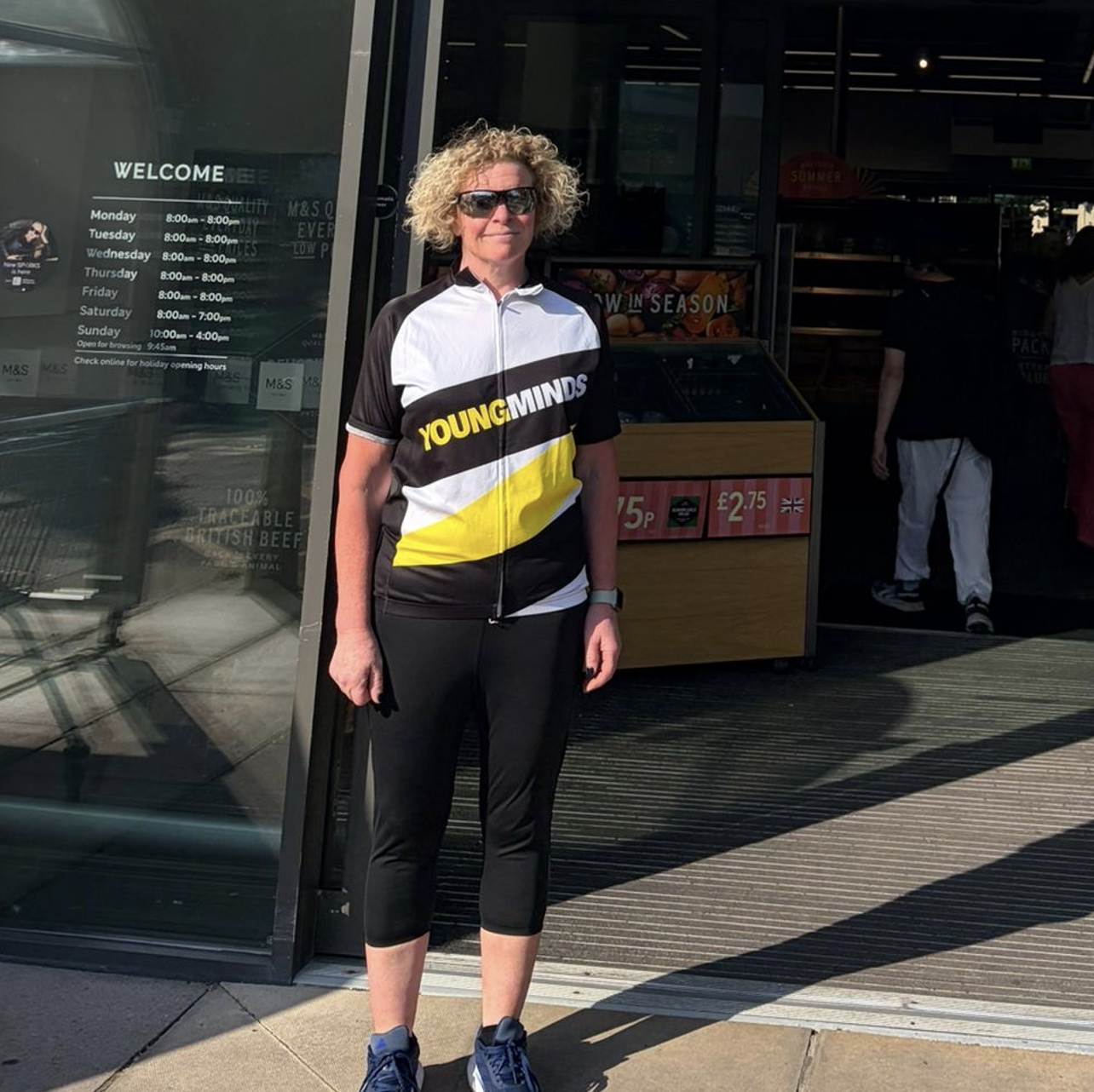 a person wearing a young minds cycling vest