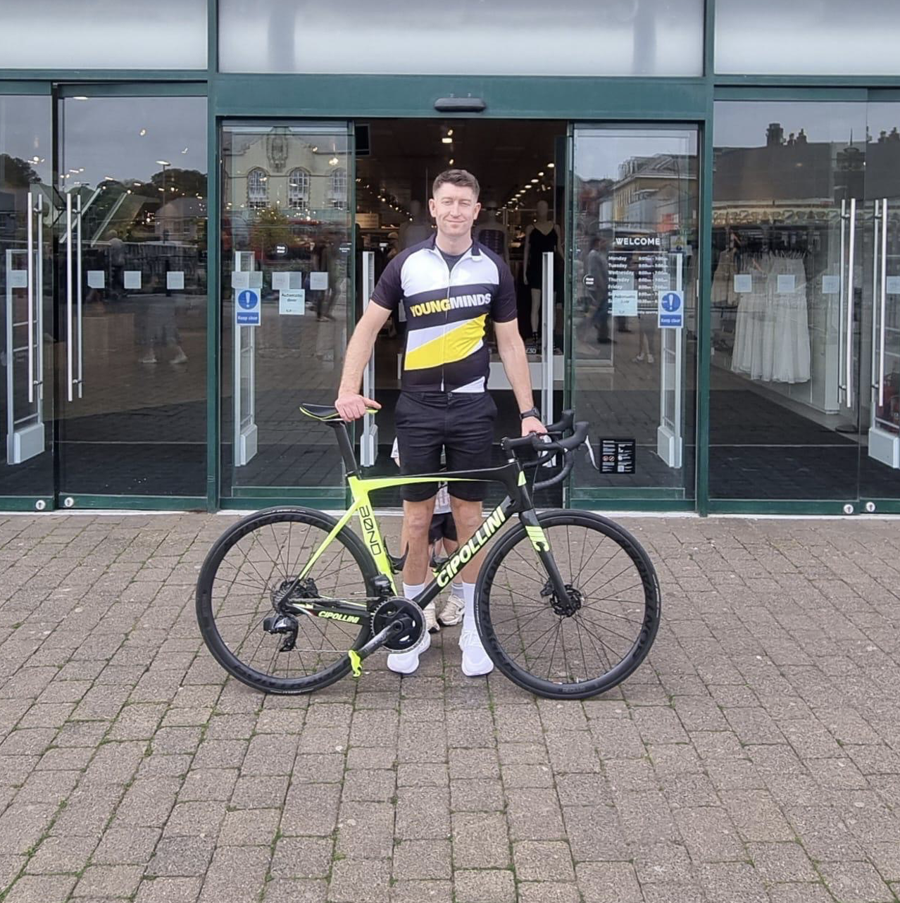 a person holding a bike