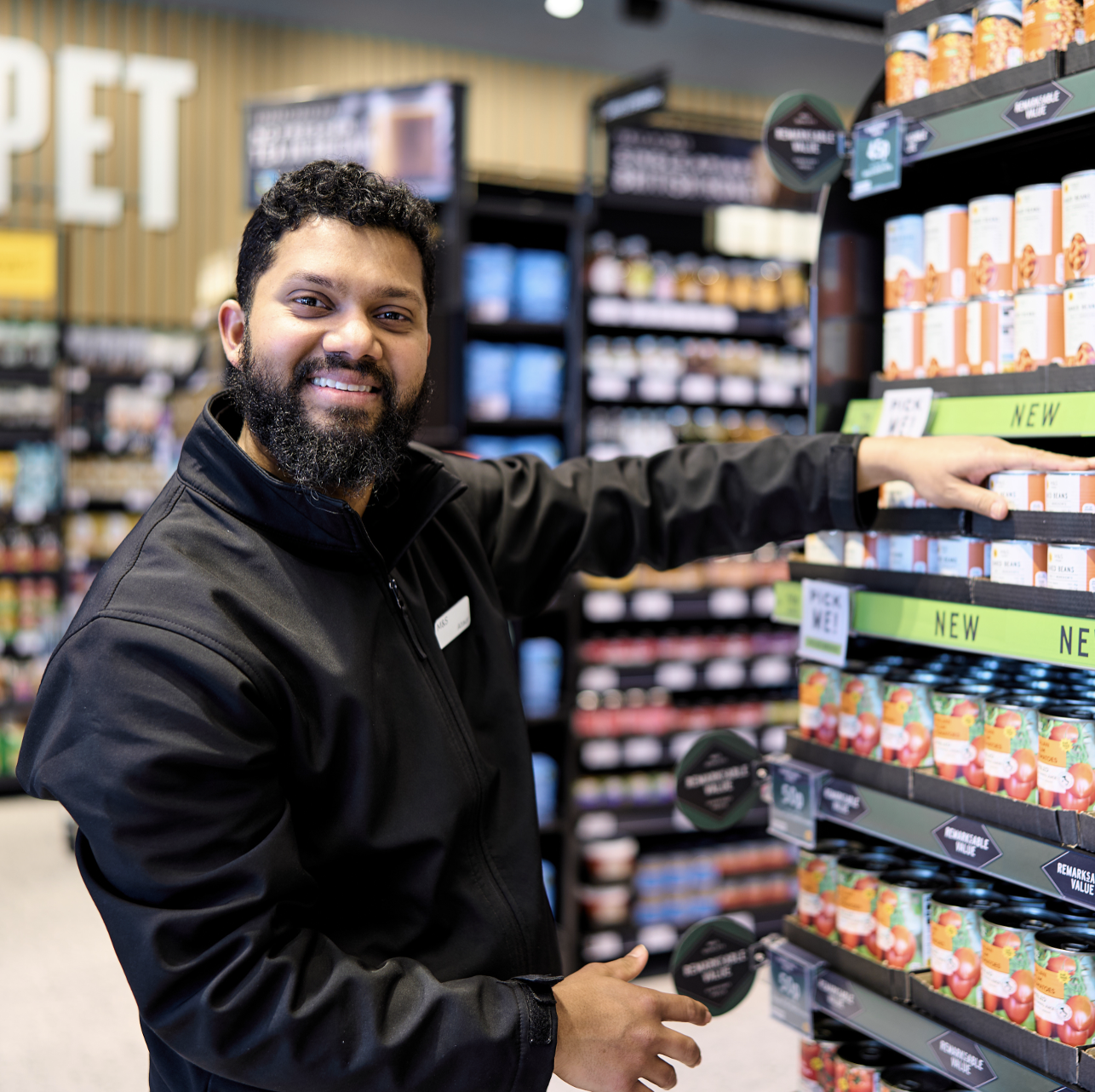 a person standing in a M&S store