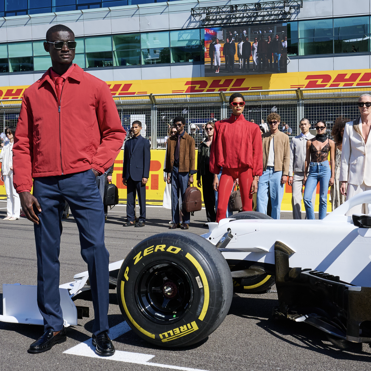 people standing by a race car