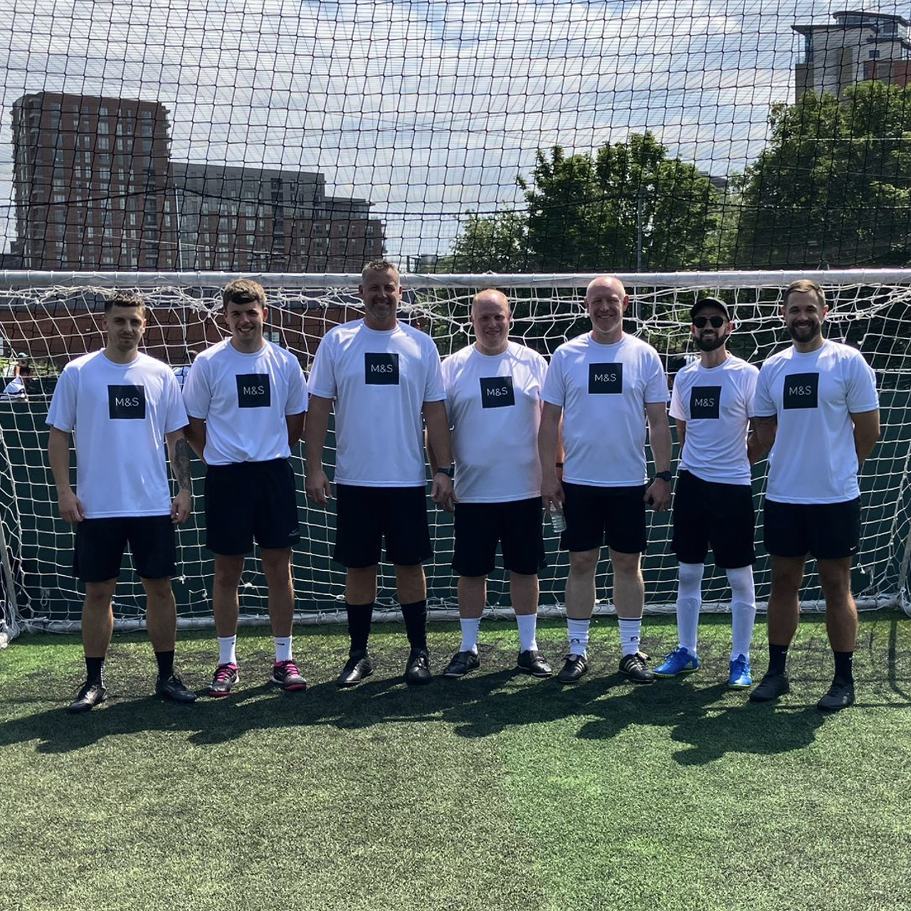 a group of people on a football pitch