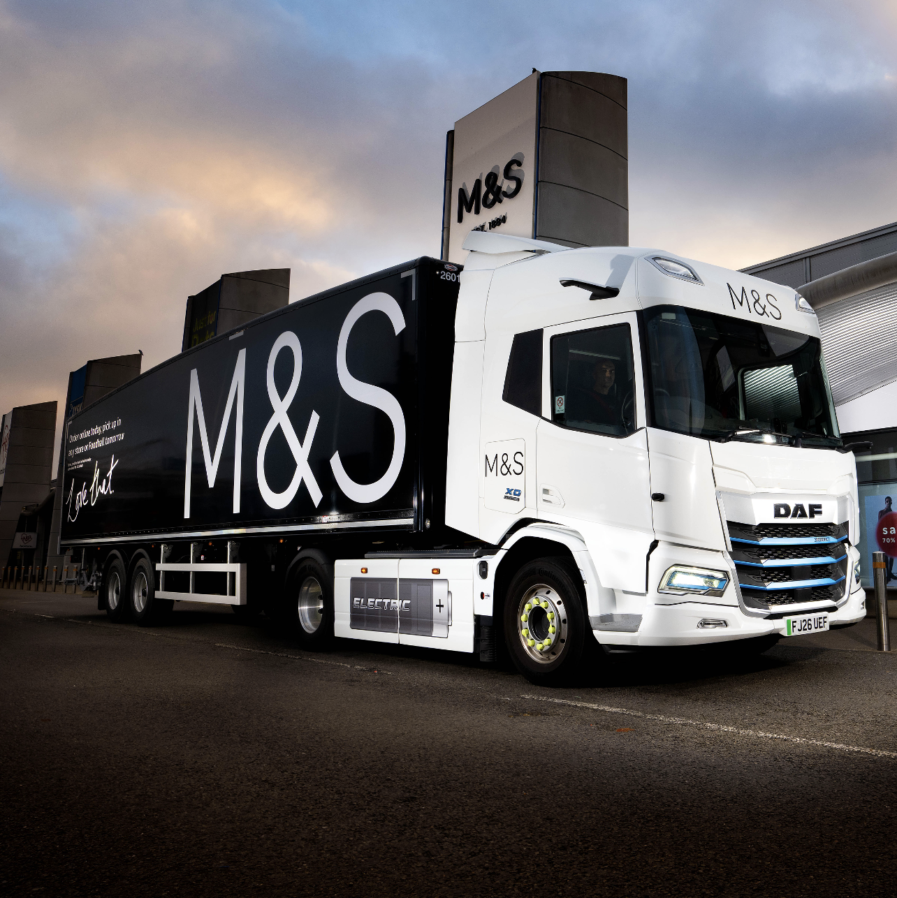 A black lorry with M&S on the side