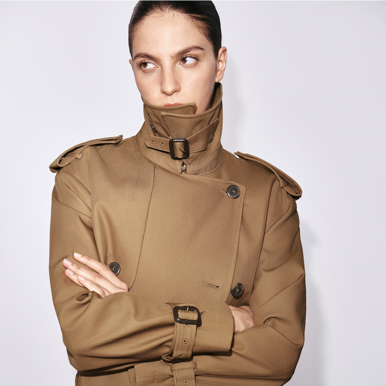 a person in a trench coat