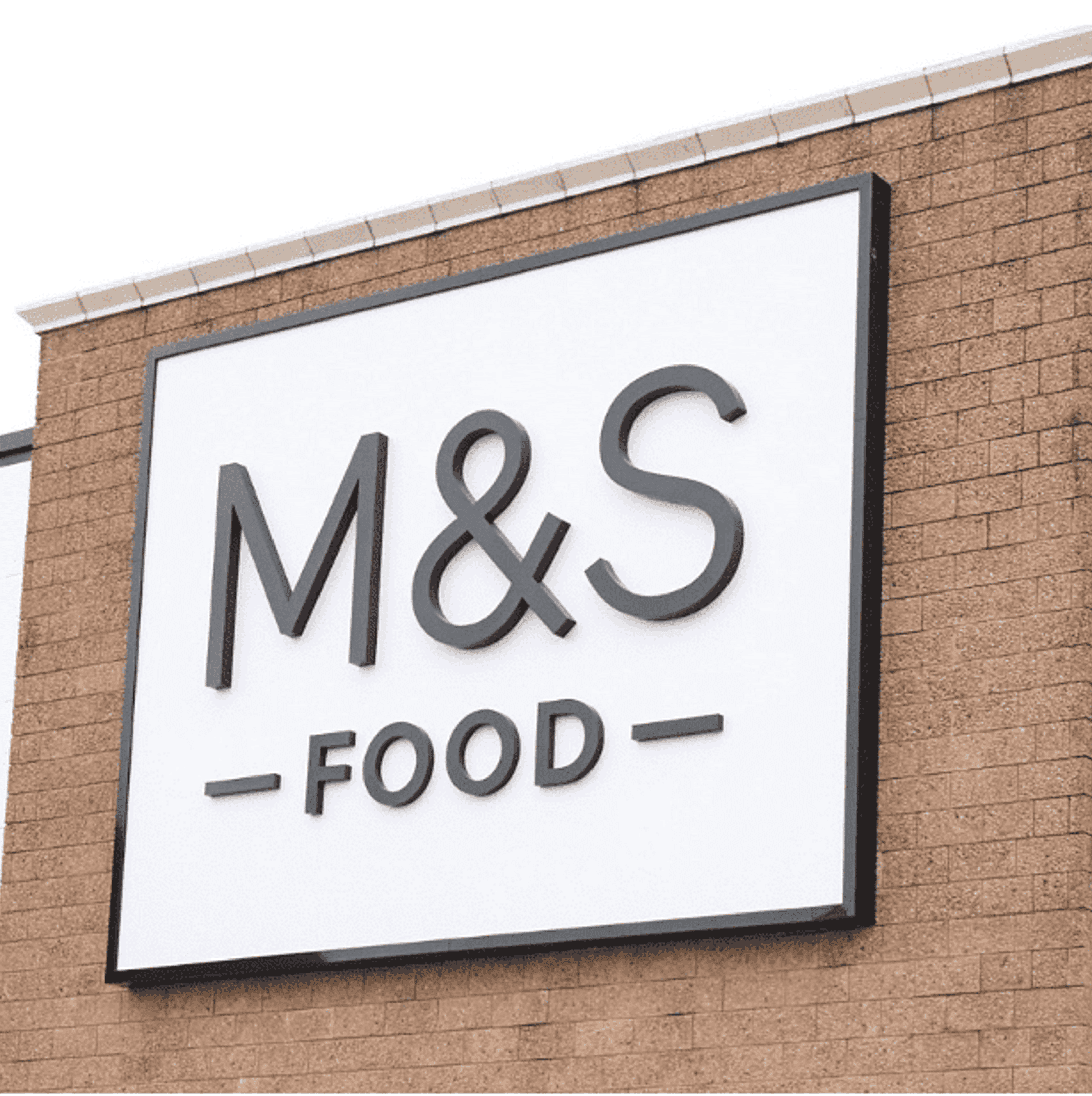 An M&S food sign on the front of a store