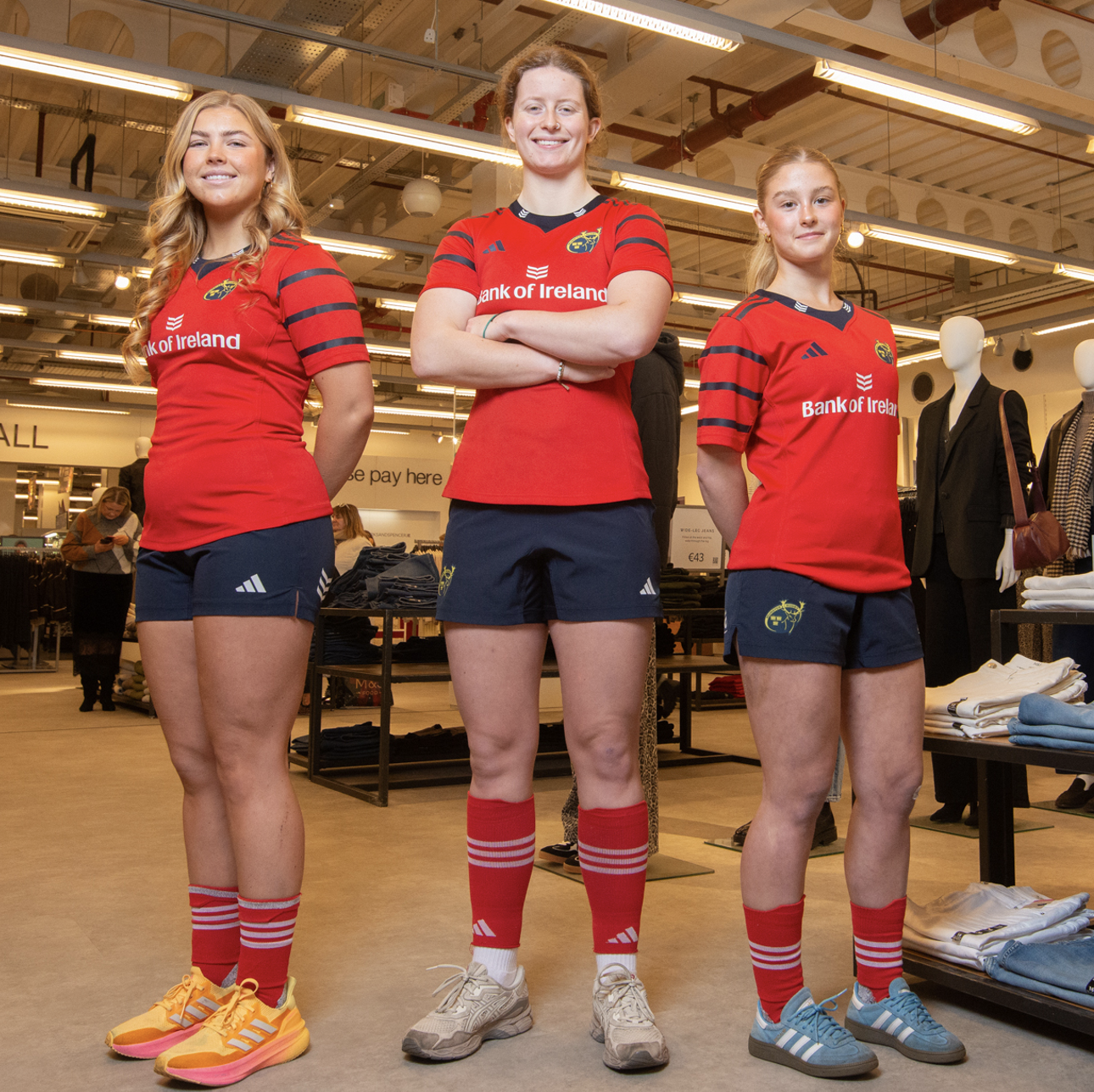 three sportswomen in an M&S store