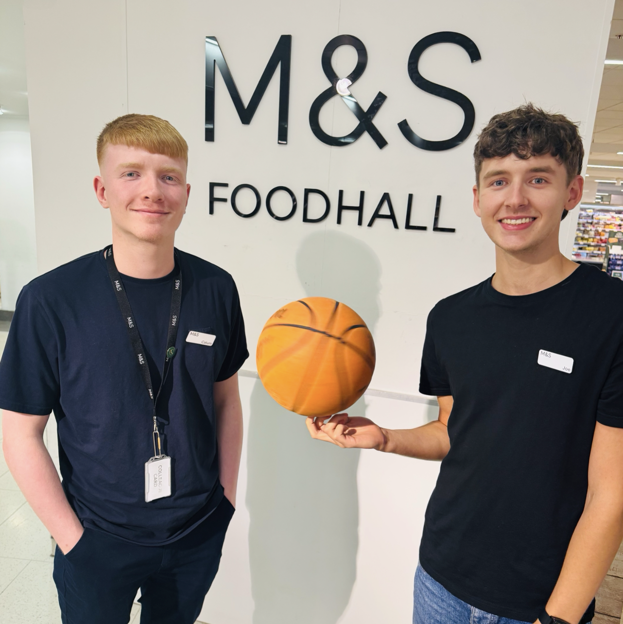 two people holding a basketball