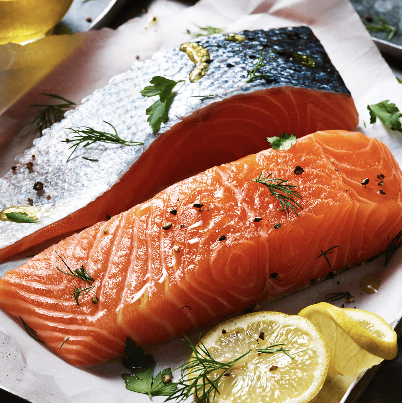 Two salmon fillets covered in herbs