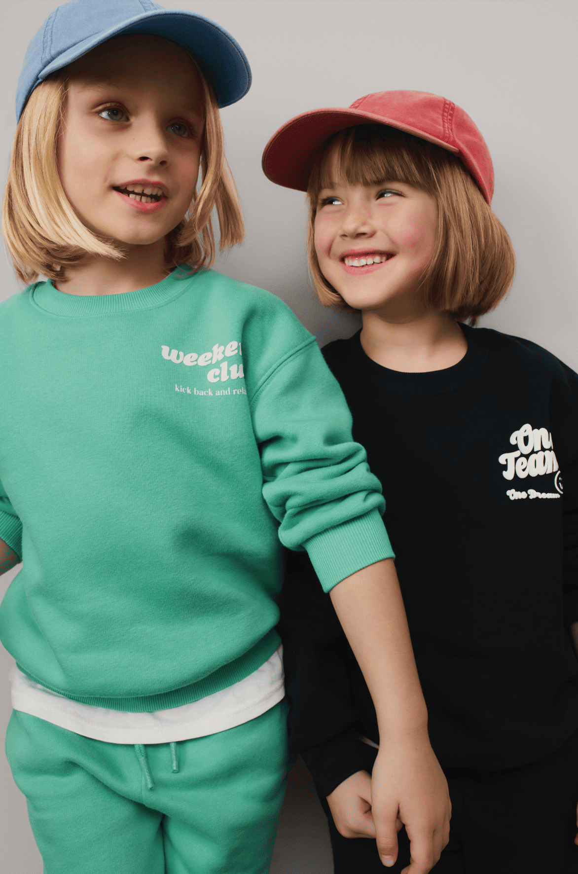 Two children smiling at each other