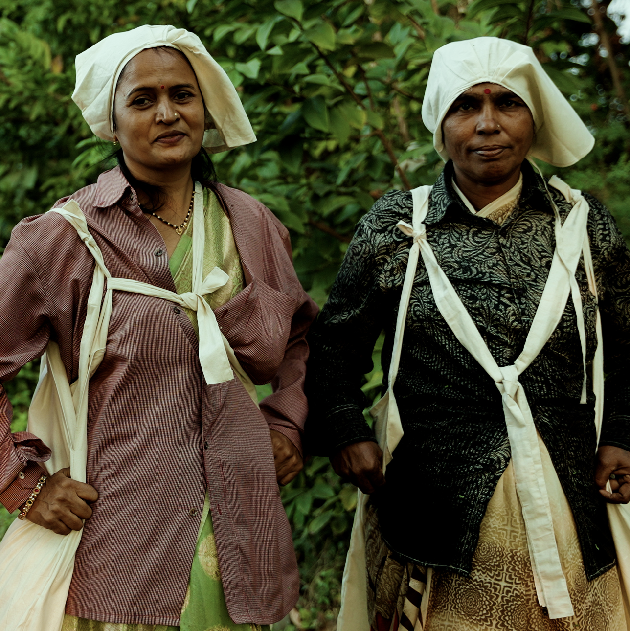 Two people smiling at the camera