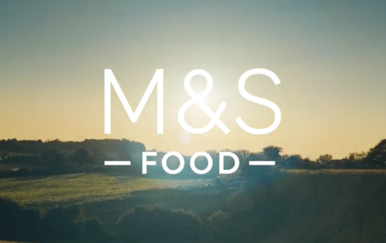 Man walking across fields and sunrise